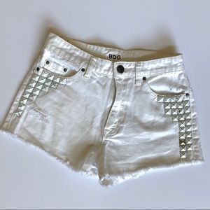 BDG studded distressed white jean shorts size 26